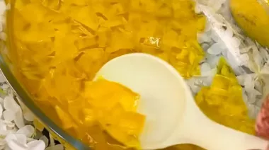 Glass bowl filled with mango sago 
